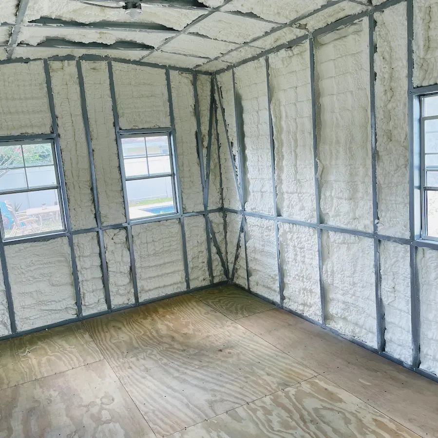 Closed-cell spray foam insulation applied to wall cavities in a residential project in Delavan